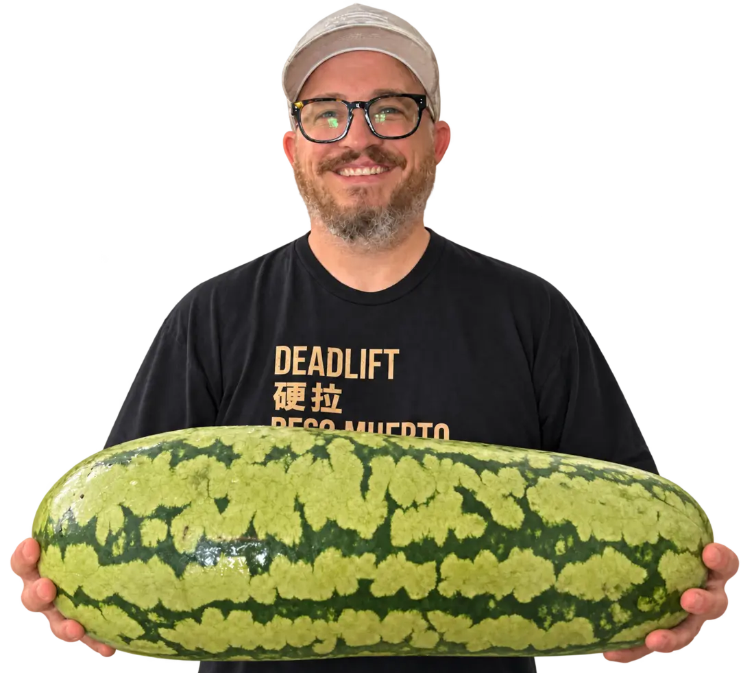Dan Crowley smiling and holding a large watermelon